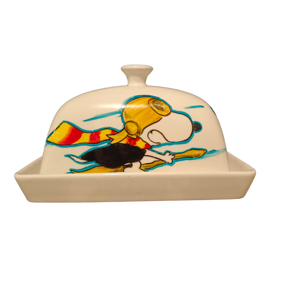 Mantequillero Snoopy jugando  Quidditch